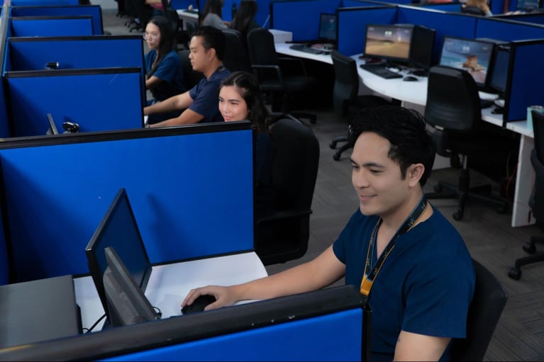 A group of call center agents, who are also registered nurses, working in a call center office in the Philippines.
