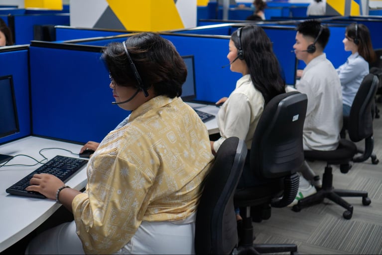 A group of Select VoiceCom call center agents during work hours in a Philippine call center office. 