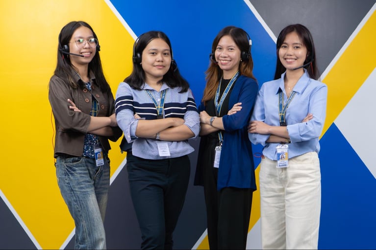 A group of female call center agents from Select VoiceCom pose for a photo op in the Philippine call center office.