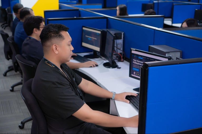 A group of call center agents (nurses) from Select VoiceCom in a frame inside a Philippine call center office.