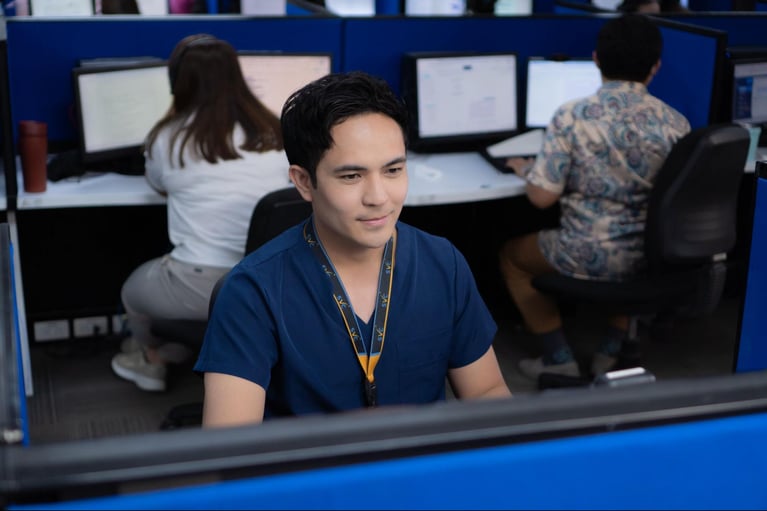 A group of call centre agents, also registered nurses, from Select VoiceCom during workhours inside a Philippine call centre office.