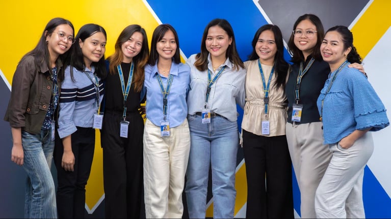 A group of female call center agents from Select VoiceCom pose for a photo op in the Philippine call center office.