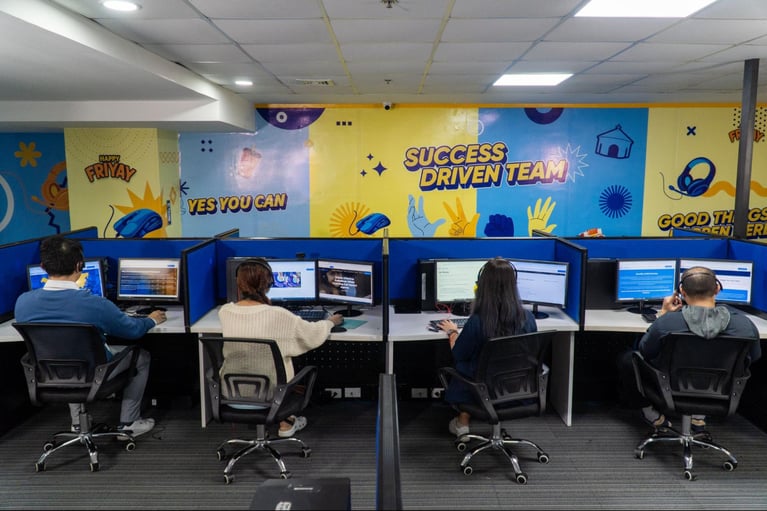 A group of Select VoiceCom call center agents during their work shifts inside a Philippine call center office.