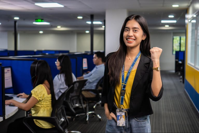 A group of Select VoiceCom call centre agents during work hours in a Philippine call centre office.