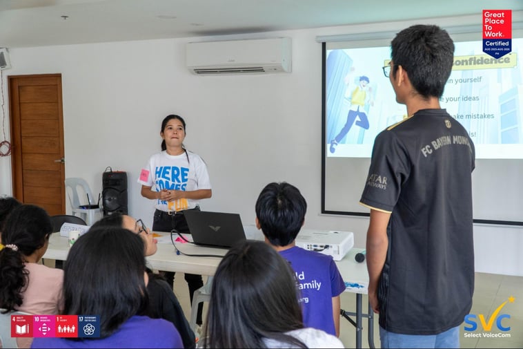 A CSC male resident answering a question from an SVC trainer during their “Speak with Confidence" workshop inside the shelter's AV room. 