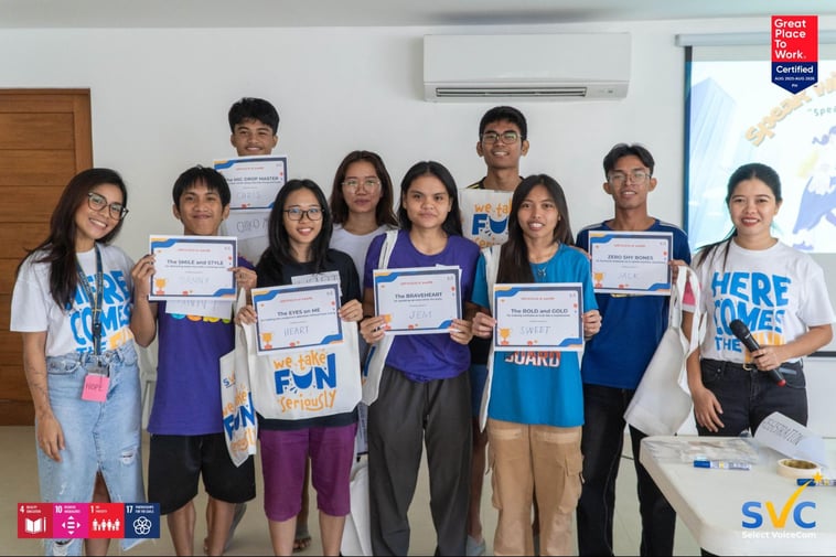 CSC residents, holding their certificates, pose for a photo op along with SVC trainers after completing the “Speak with Confidence" workshop inside the shelter's AV room. 
